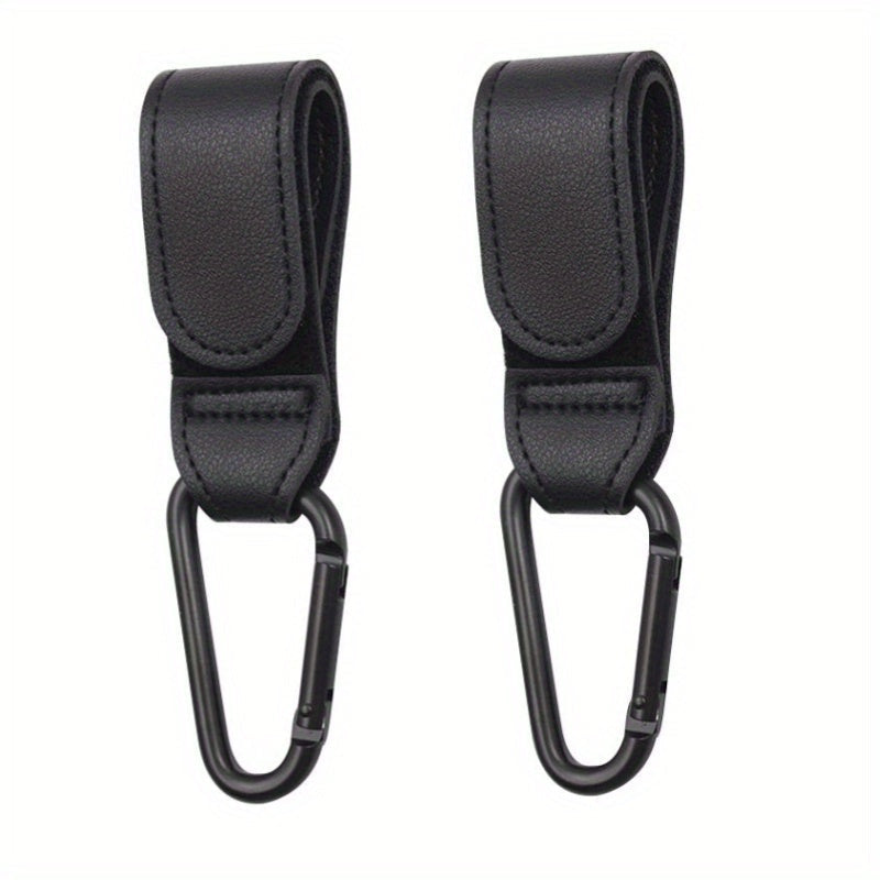 Set of 2 Stroller Hooks for Hanging Diaper Bags, Grocery Shopping Bags, or Pram Straps. The perfect multi-purpose gift for Christmas, Halloween, Thanksgiving, or any occasion. Made of high-quality faux leather.