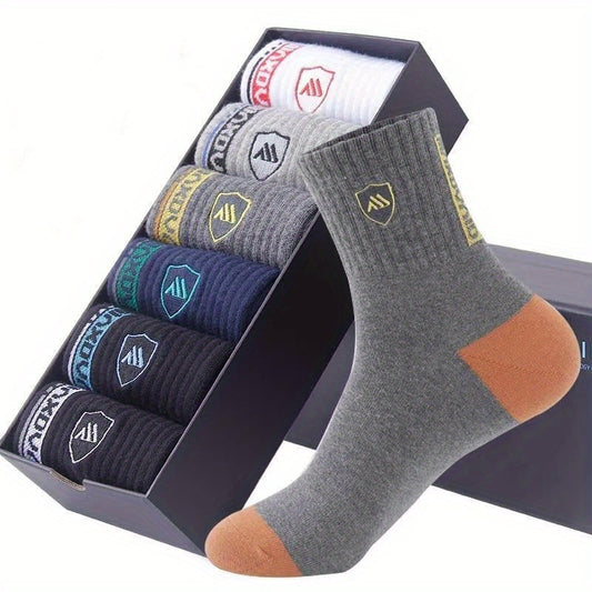 5 pairs of men's trendy color block crew socks, breathable and comfortable for outdoor wearing in all seasons.