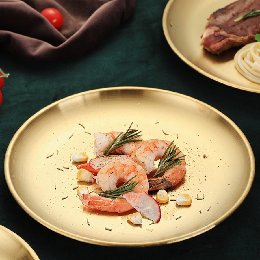 Thickened stainless steel round plate with golden finish, suitable for serving fruit, cake, bone dishes, and more in restaurants or for hot pot and BBQ.