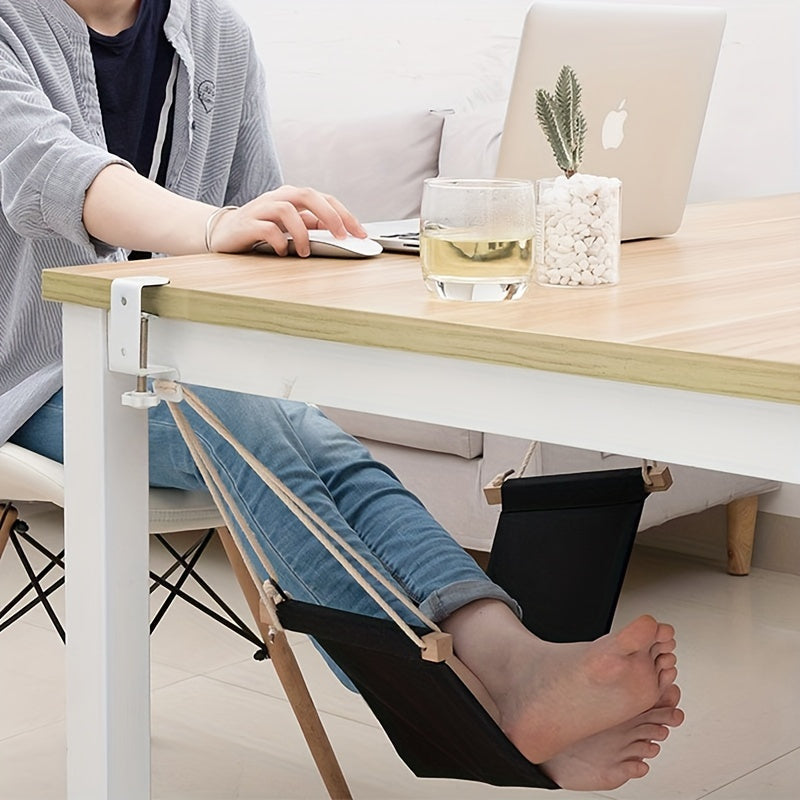 Portable under-desk footrest hammock made of linen in black and orange, adjustable for use in office, home, garden, and camping.