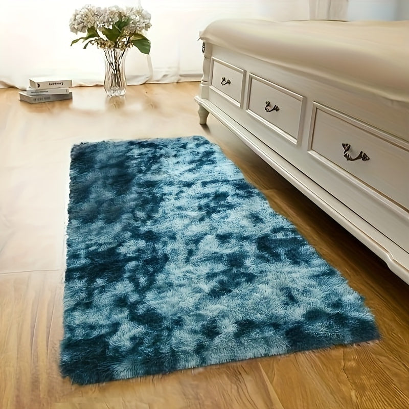 This plush rug in tie-dye style adds a modern and simple touch to any indoor space. It is soft, comfortable, fluffy, and easy to manage, creating a cozy atmosphere in your bedroom, living room, leisure area, entertainment area, or any other indoor space.