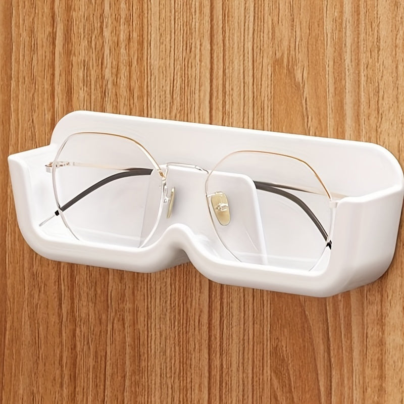 Wall-mounted sunglasses display rack for organizing and storing glasses.