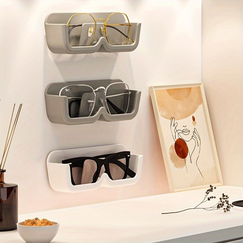 Wall-mounted sunglasses display rack for organizing and storing glasses.