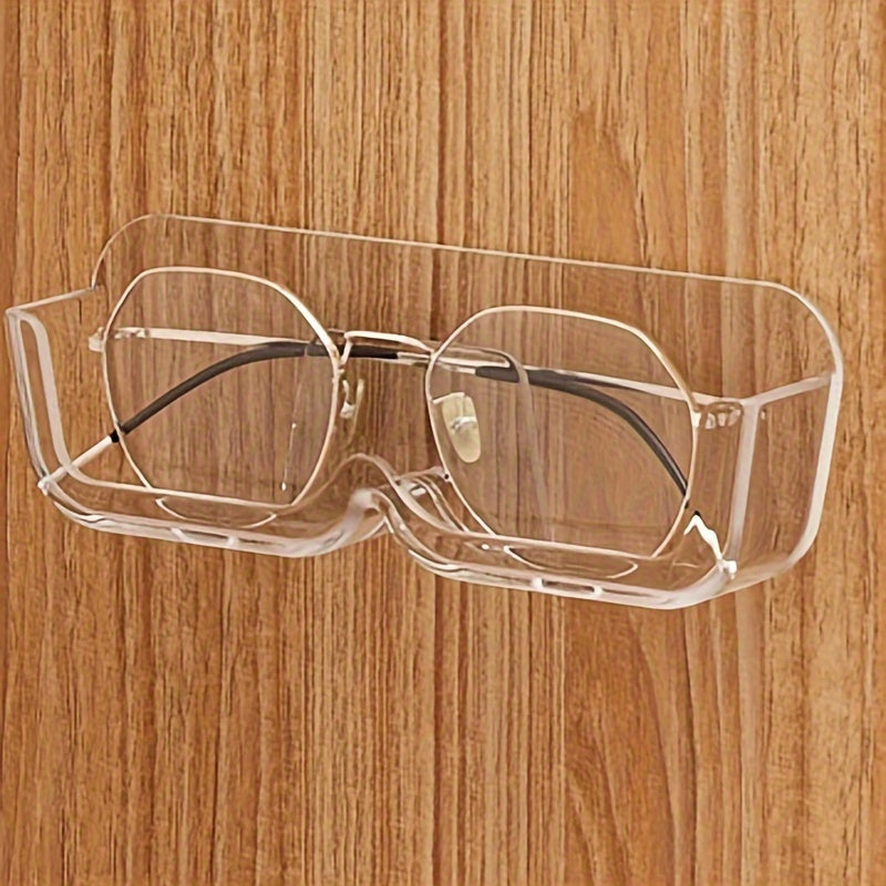 Wall-mounted sunglasses display rack for organizing and storing glasses.