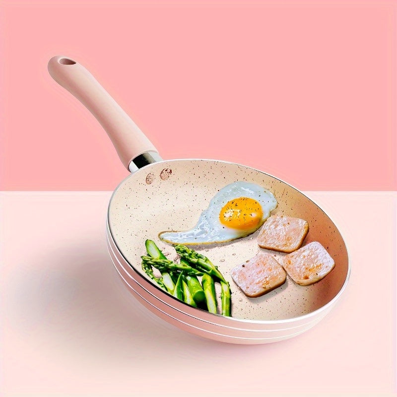 This Pink Maifan Stone Non-Stick Skillet measures 16.51cm and is ideal for making soups and frying. Made of durable aluminum, this cookware must be hand washed for best results.