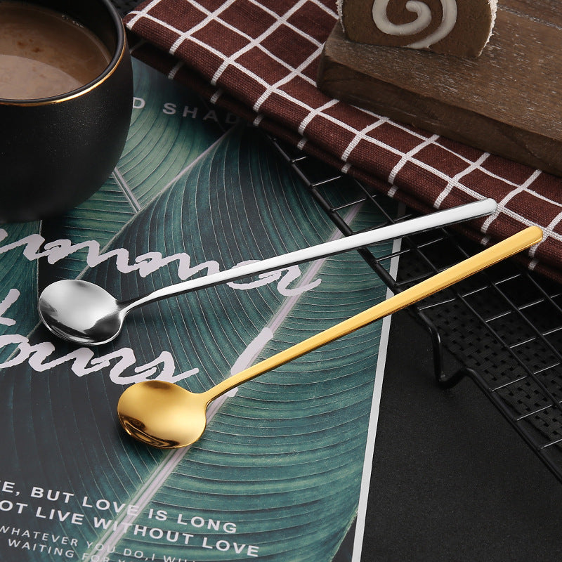 A trio of small round spoons made from durable stainless steel, featuring a luxurious golden finish. Ideal for stirring honey, coffee, and desserts. Makes a thoughtful gift or a stylish addition to your kitchen collection. Perfect for enjoying bird's