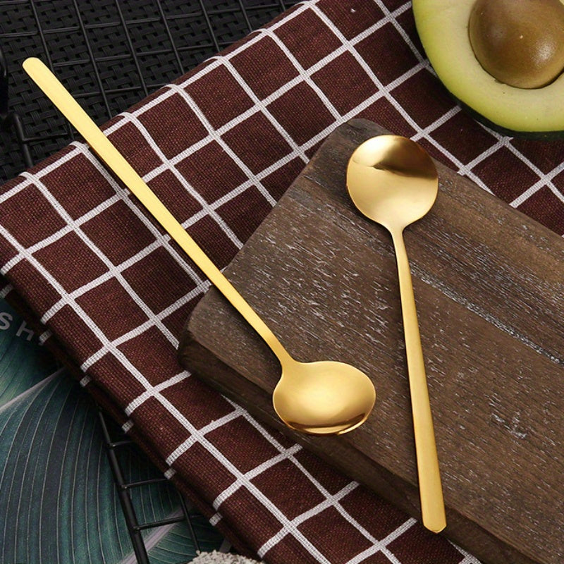 A trio of small round spoons made from durable stainless steel, featuring a luxurious golden finish. Ideal for stirring honey, coffee, and desserts. Makes a thoughtful gift or a stylish addition to your kitchen collection. Perfect for enjoying bird's