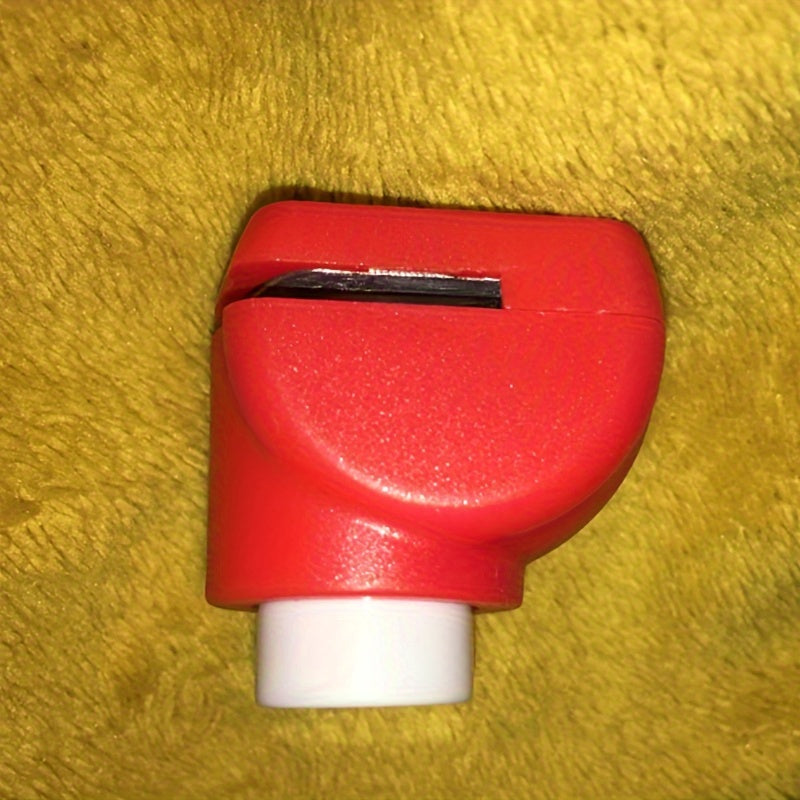 Mini heart-shaped paper punch in red for DIY crafts.