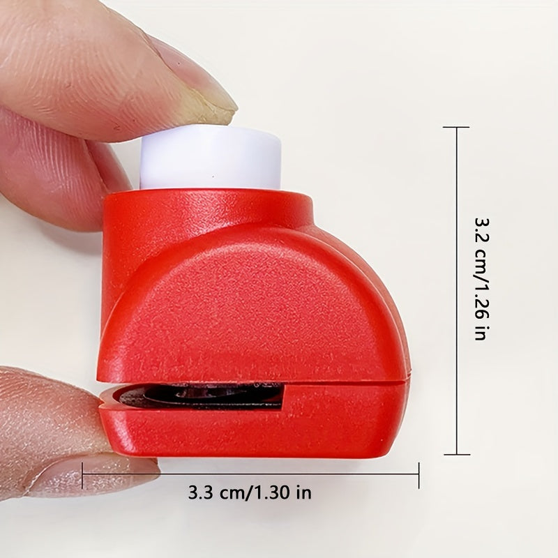 Mini heart-shaped paper punch in red for DIY crafts.