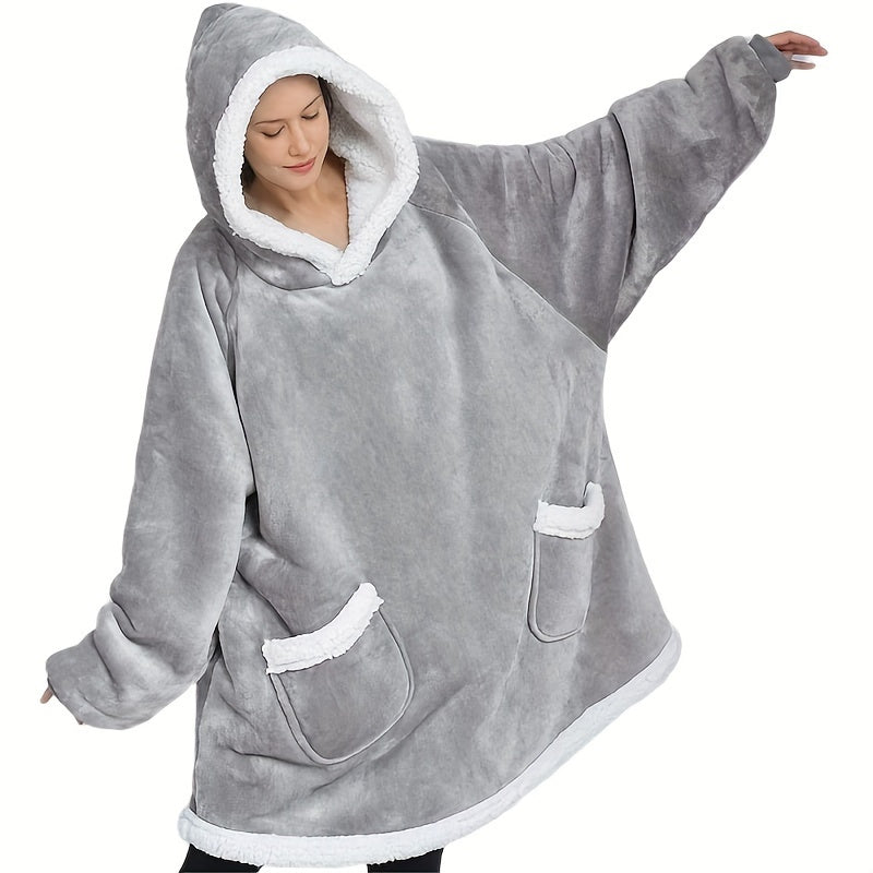 Stay warm and cozy this winter with our oversized Sherpa hoodie blanket. Designed for both men and women, this wearable blanket features a convenient pocket and is the perfect addition to your winter pajama collection.