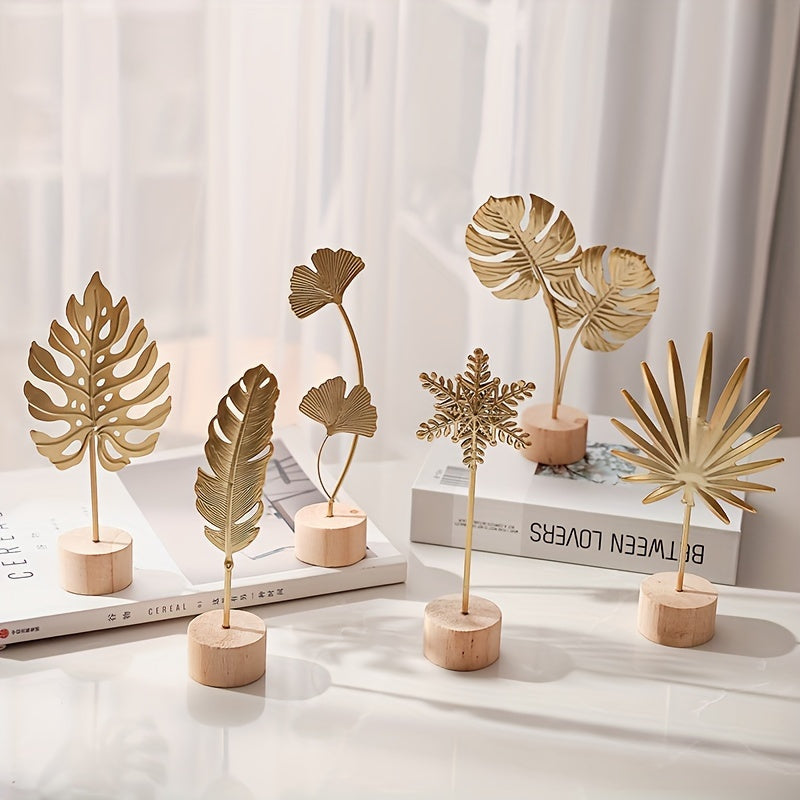 One elegant Nordic-inspired metal art decor featuring iron leaf, snowflake, and palm designs on a wooden base. Perfect for contemporary home and bedroom accents.