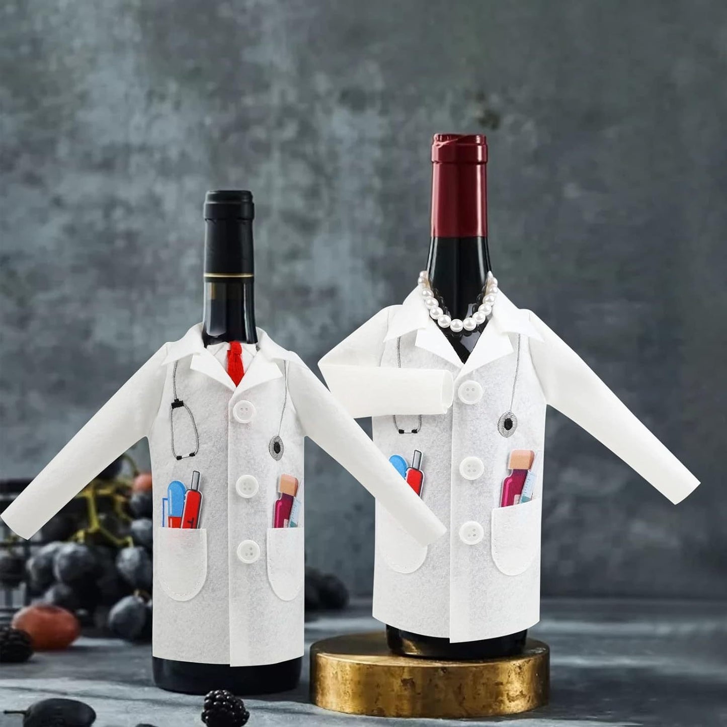 Charming doctor coat-style wine bottle cover made of durable felt material, featuring stethoscope and pill bottle design. Perfect gift for professionals, retirees, anniversaries, graduations, and more. Playful packaging included.