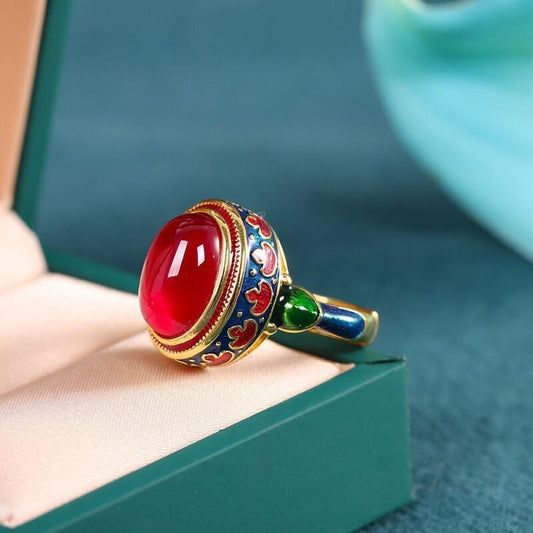 Vintage style finger ring jewelry decoration with a red faux jade band, inlaid and adjustable.