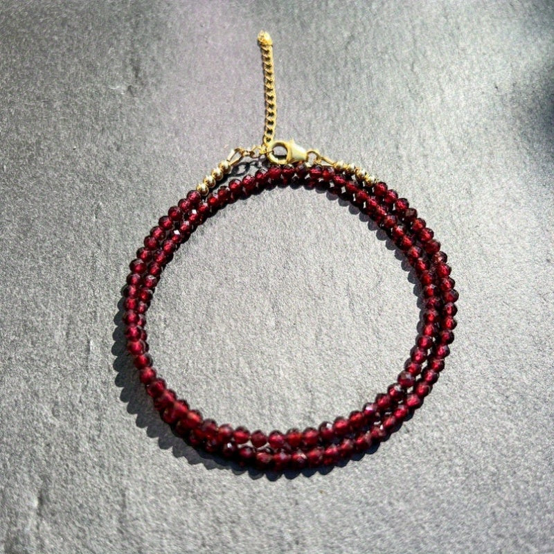 A delicate AAA red garnet beaded necklace measuring 3mm or 0.12 inches, featuring bright red gemmy micro-faceted garnet stones. This dainty January birthstone crystals necklace is perfect for daily wear and versatile fashion.