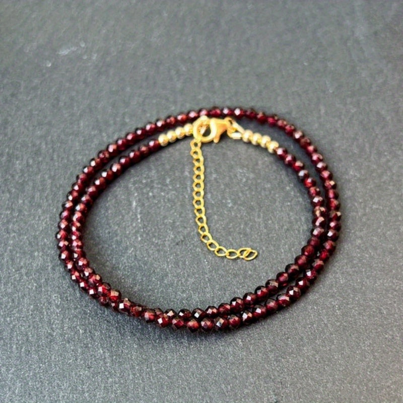 A delicate AAA red garnet beaded necklace measuring 3mm or 0.12 inches, featuring bright red gemmy micro-faceted garnet stones. This dainty January birthstone crystals necklace is perfect for daily wear and versatile fashion.