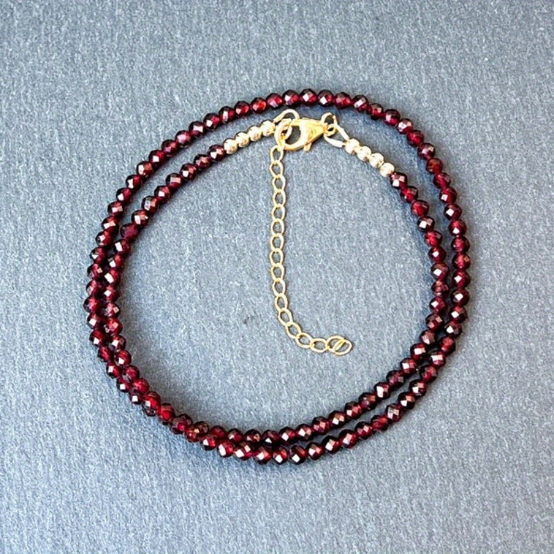 A delicate AAA red garnet beaded necklace measuring 3mm or 0.12 inches, featuring bright red gemmy micro-faceted garnet stones. This dainty January birthstone crystals necklace is perfect for daily wear and versatile fashion.