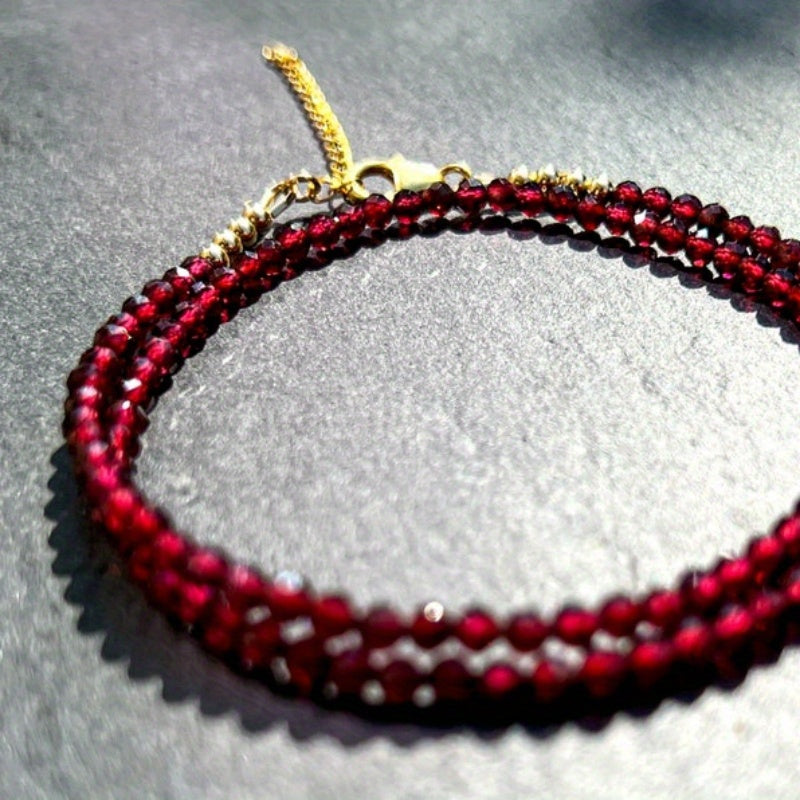 A delicate AAA red garnet beaded necklace measuring 3mm or 0.12 inches, featuring bright red gemmy micro-faceted garnet stones. This dainty January birthstone crystals necklace is perfect for daily wear and versatile fashion.