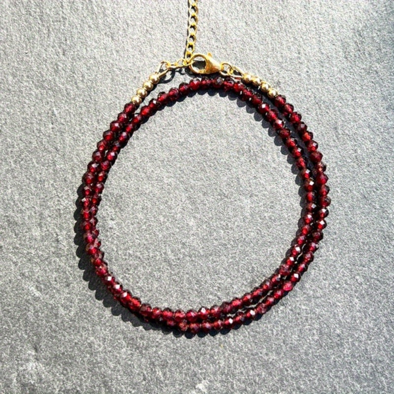 A delicate AAA red garnet beaded necklace measuring 3mm or 0.12 inches, featuring bright red gemmy micro-faceted garnet stones. This dainty January birthstone crystals necklace is perfect for daily wear and versatile fashion.