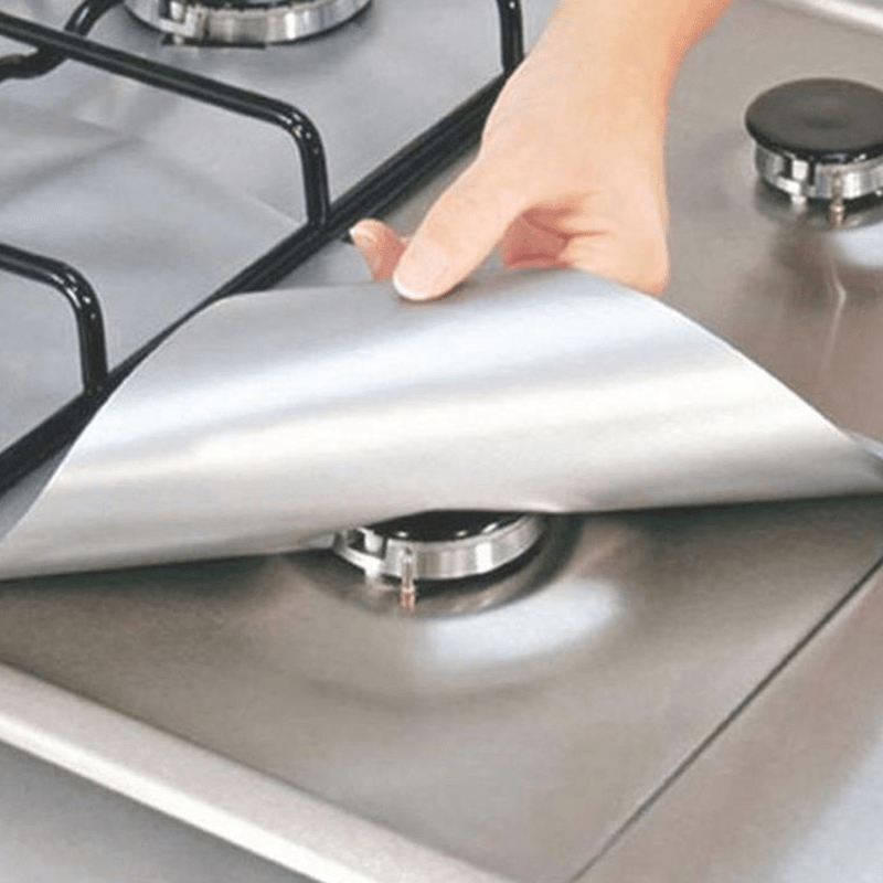 A set of 4 durable gas stove burner covers made from heat-resistant synthetic fiber, featuring a non-stick surface that is oil-proof and anti-fouling. These reusable covers can be cut to fit your stove, providing easy-to-clean protection without the need