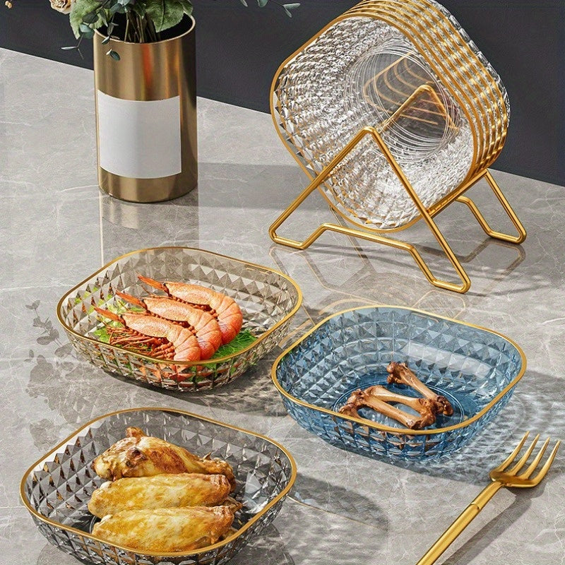 Set of 4 elegant fruit bowls with golden rim and assorted dishware for serving desserts and snacks in style.