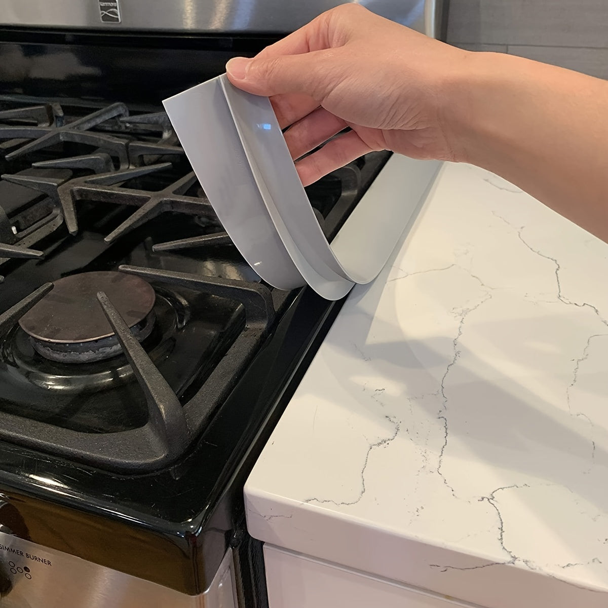 Protect your kitchen stove with the 1pc Counter Gap Cover. This anti-spill, oil and grease-proof sealing strip is perfect for gas ranges. It is easy to clean, heat-resistant, waterproof, dustproof, and blocks out dirt. Keep your home safe and clean with