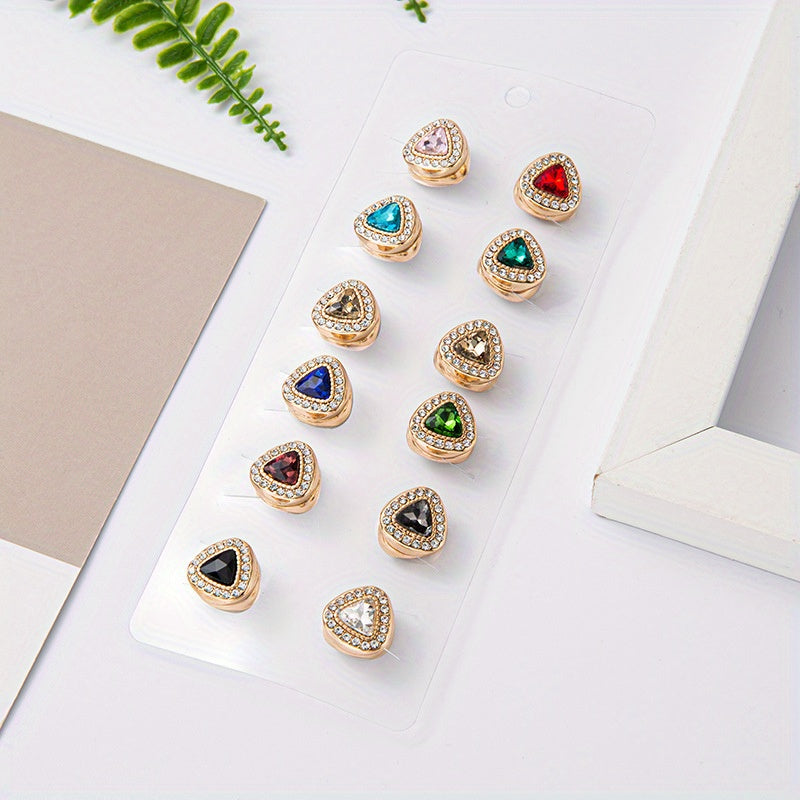 Colorful hijab magnetic pins in heart shape design with rhinestone embellishments. This set includes 12 pieces of turban magnet buckle clips to secure your bandana, gauze scarf, or any other accessory in place. Ideal for adding a touch of sparkle to your