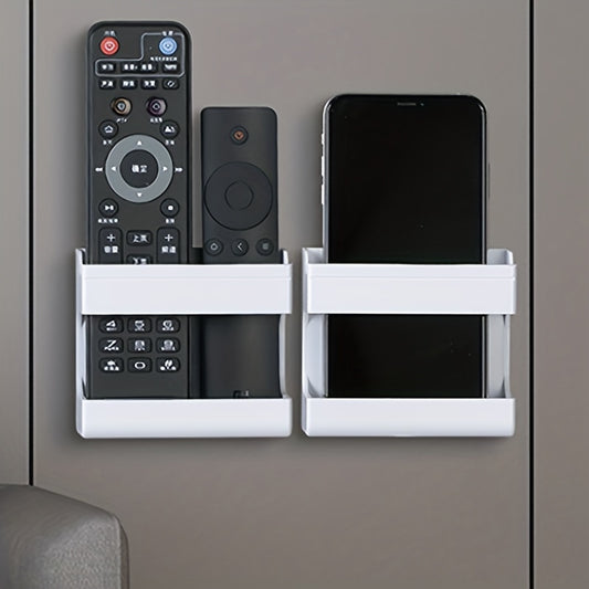 Wall-mounted storage bracket for phones and remotes, no drilling required.