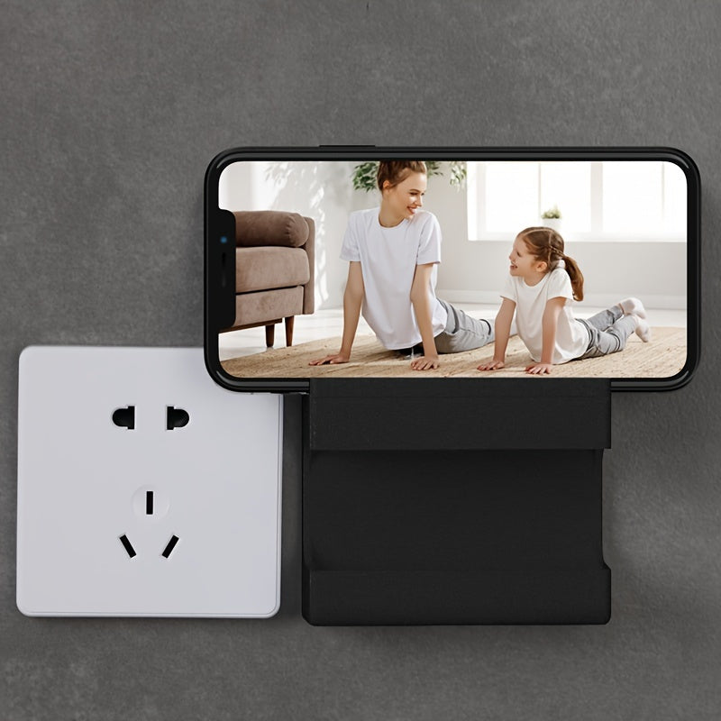 Wall-mounted storage bracket for phones and remotes, no drilling required.