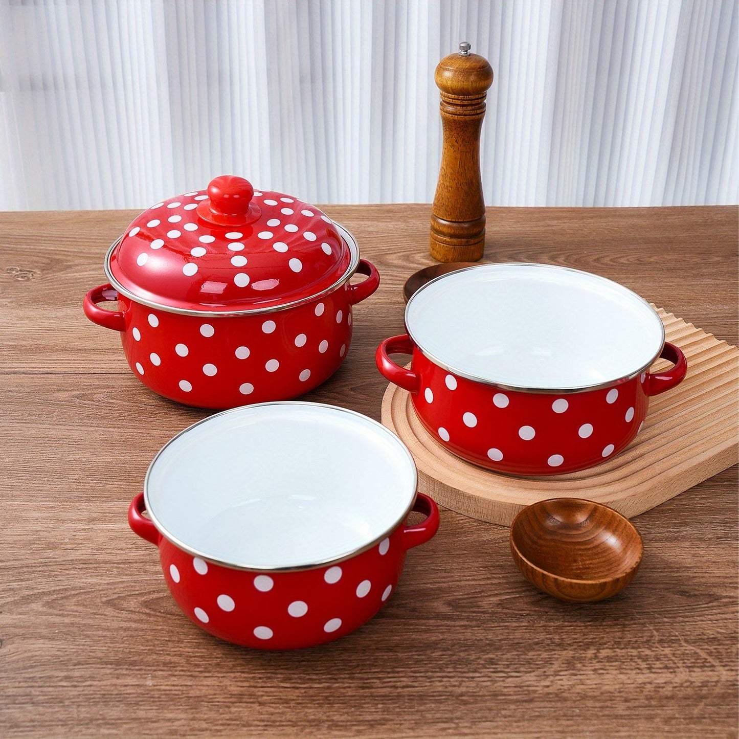 Enamel pot set including a soup pot, stew pot, and boiling pot for use in restaurants or home kitchens. Suitable for gas, electric stoves, and open fire cooking, but not safe for use in microwave ovens. Ideal kitchenware supplies.