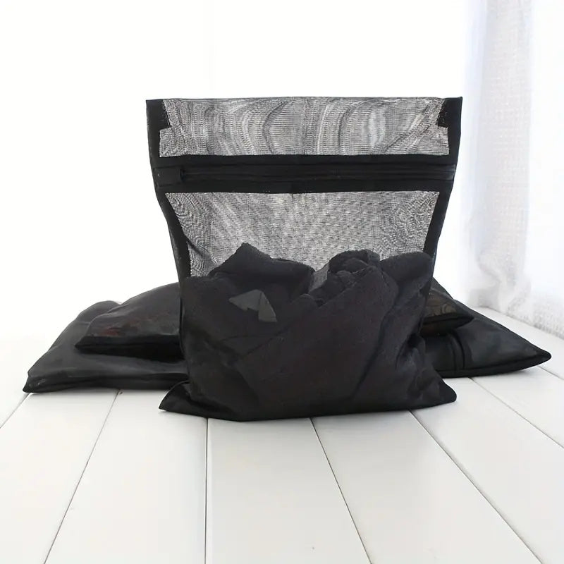 Set of three durable mesh laundry bags designed for delicate items - prevents clothes from getting wrinkled or stained, great for larger pieces, perfect for use at home or in dorms. Ideal for laundry care.