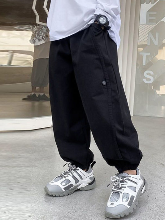 Boys casual cargo jogger pants with elastic waist and pockets for outdoor fashion.