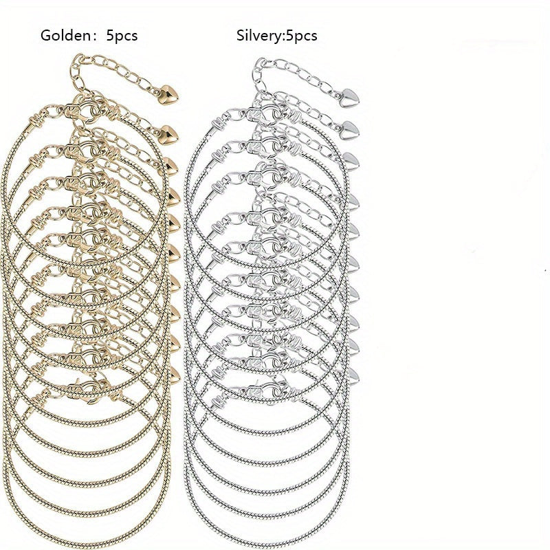 Набор из 10 элегантных браслетов из цепочки в форме змеи, доступных в золотых или серебристых тонах, с застежками в виде сердечка. Идеально подходит для создания собственных ювелирных изделий или в качестве продуманного подарка.