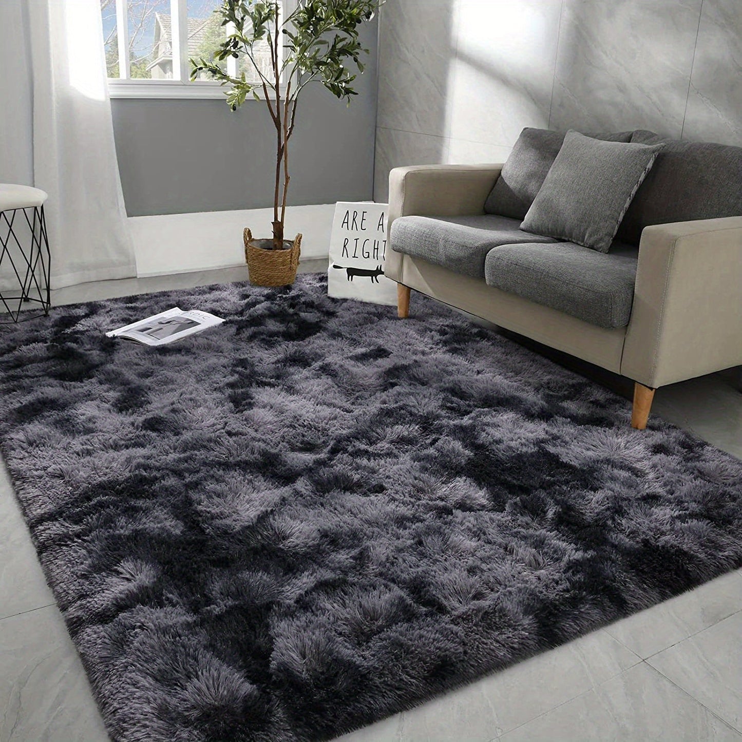 Luxurious non-slip dark gray carpet with a cute and soft fluffy shag design, perfect for living rooms and bedrooms. Machine washable and ideal for adding a touch of luxury to home decor.