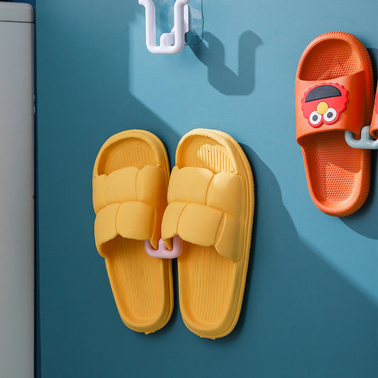 Space-saving shoe rack that can be mounted on walls, made of durable plastic with a drain design. This slipper holder does not require drilling and is suitable for bathroom or wardrobe storage. Easy to install and does not need electricity to dry shoes.