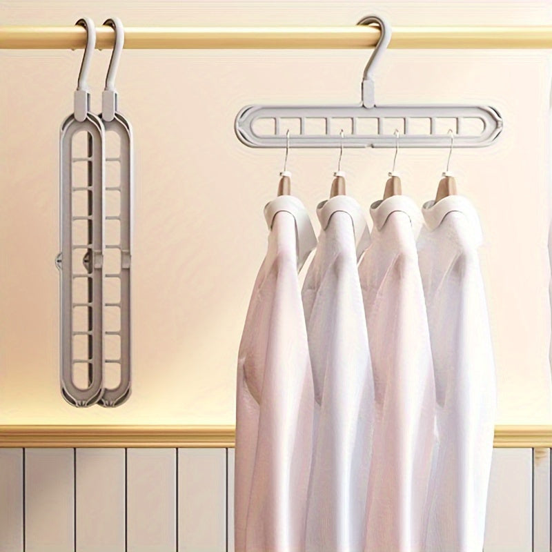 Space-saving multi-hole clothes hanger for home, dorm, and travel - foldable drying rack for trousers, shirts, and skirts, also doubles as a shower caddy.