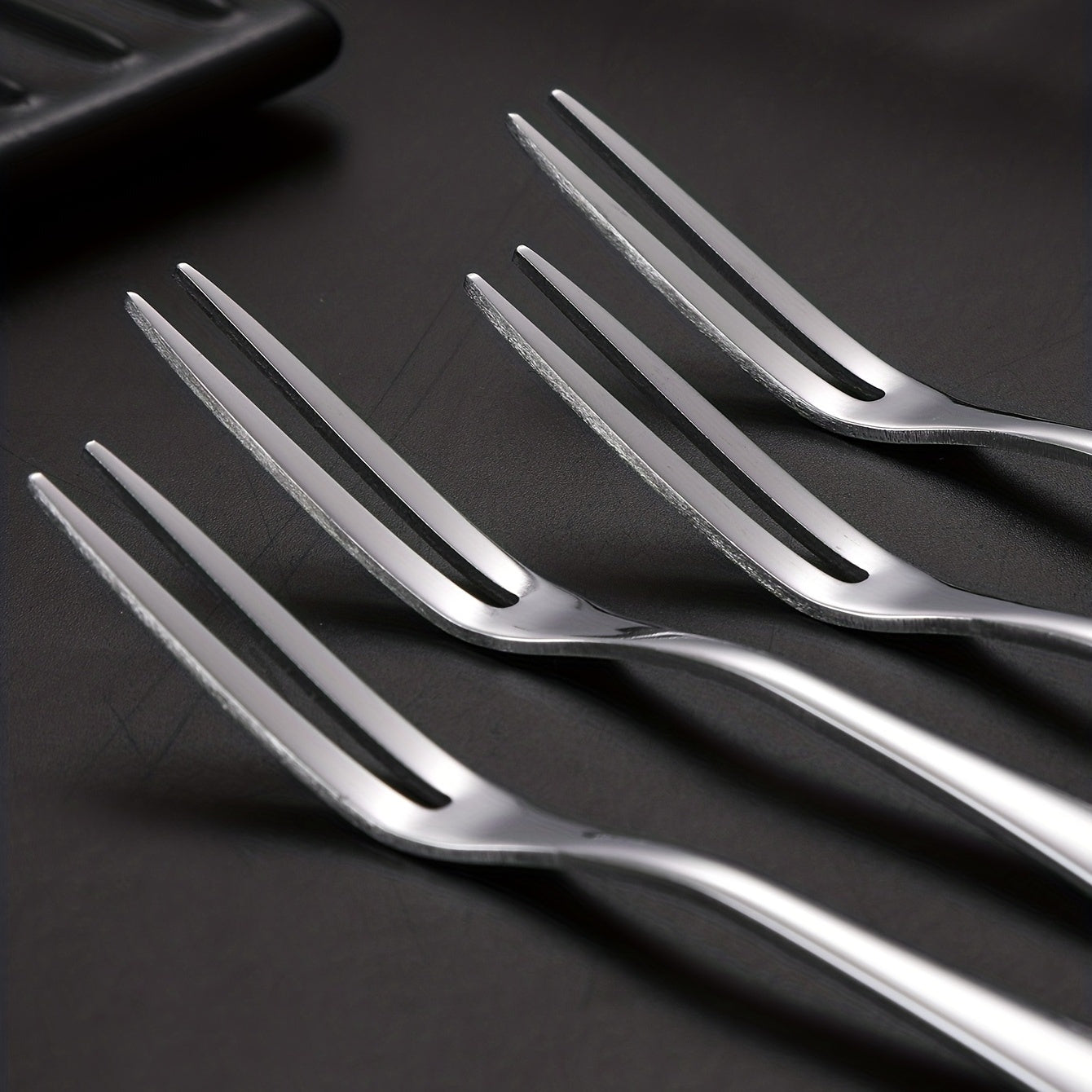 Stainless steel fruit forks for desserts and salads, modern and reusable.