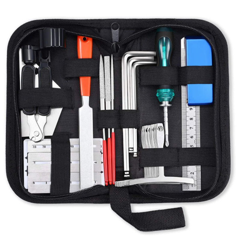 Guitar maintenance kit with essential tools for repairs and cleaning.