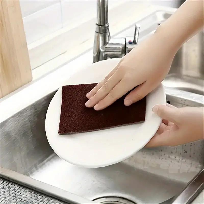 Sponge cloths with diamond sand, suitable for cleaning pots, dishes, and household kitchen items. Helps with rust removal, grinding, and general cleaning. Can also be used as a magic sponge for wiping surfaces. Available in packs of 10 or 20 pieces.