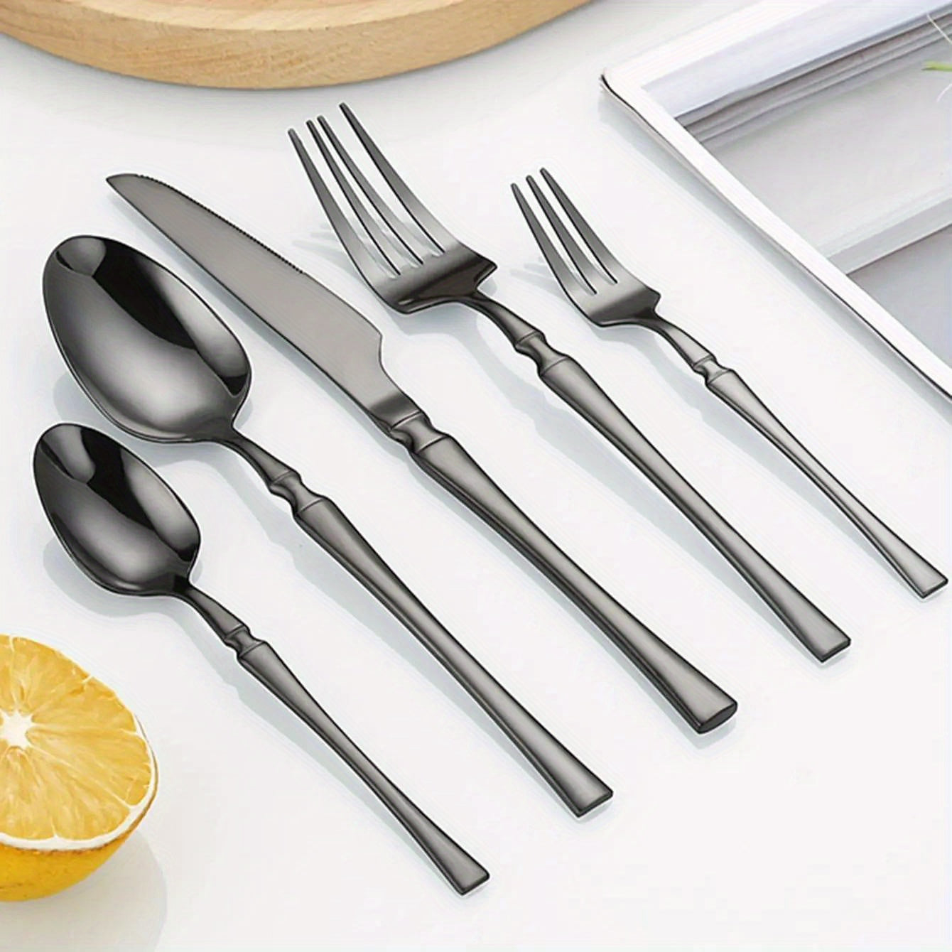 30-piece stainless steel tableware set for use in hotels, banquets, and restaurants, includes steak knife, fork, and dessert spoon.