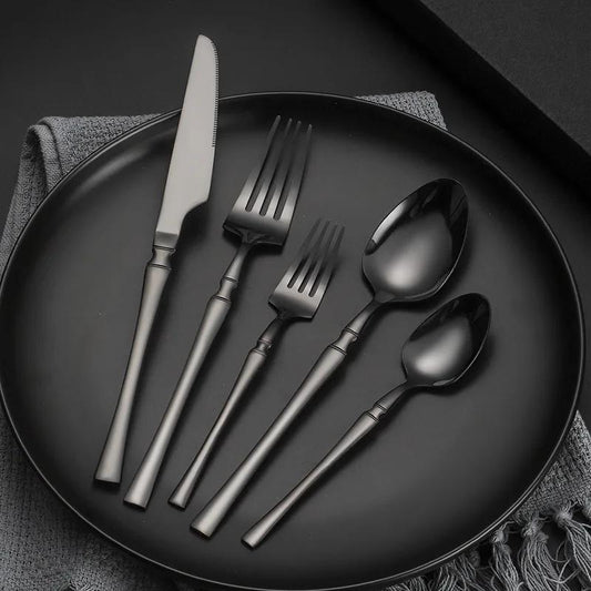 30-piece stainless steel tableware set for use in hotels, banquets, and restaurants, includes steak knife, fork, and dessert spoon.