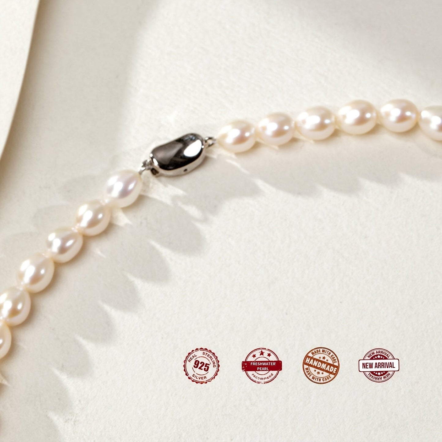 Necklace featuring freshwater pearls in rice shapes, accented with a silver-plated big natural pearl, presented in a gift box.