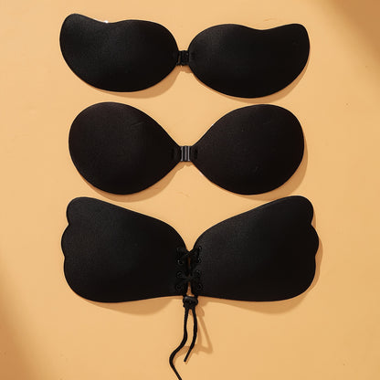 Set of 3 front lace-up stick-on bras, breathable and reusable, perfect for strapless wear. Feminine lingerie accessory.