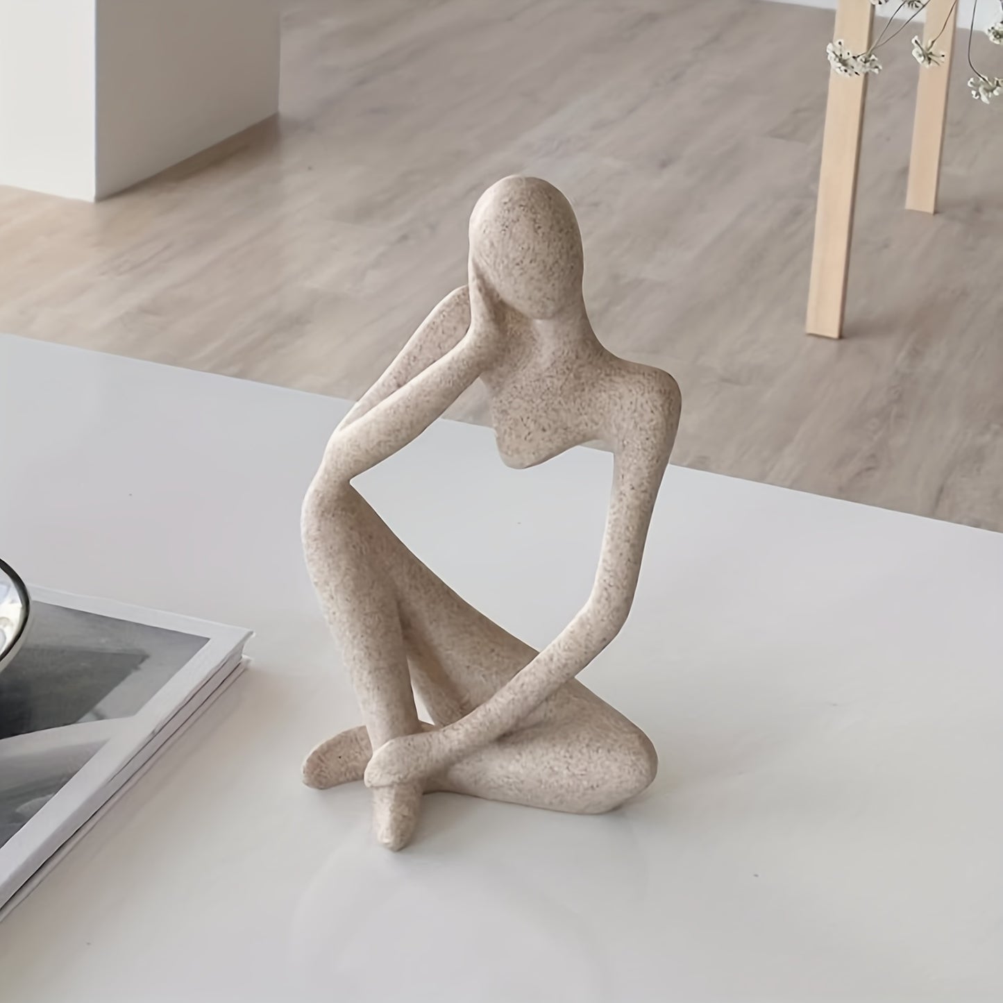 Chic, modern "The Thinker" resin sculpture for home or office decor. Perfect for living room display.