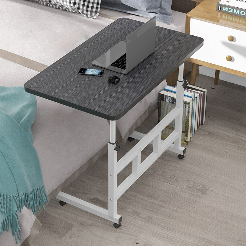 Adjustable & portable laptop desk made of sleek wood for home, sofa, or bedside use.