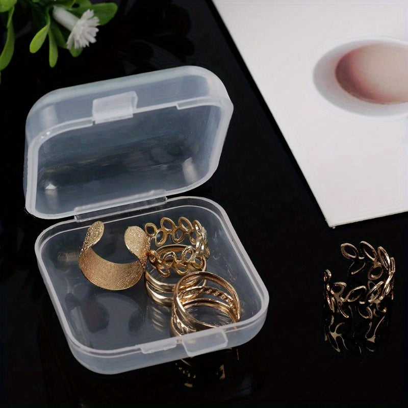 6 Mini clear plastic storage boxes with snap lids, ideal for organizing jewelry, earrings, and small items. Perfect for modern home decor and secure storage.