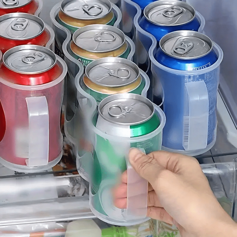 Clear plastic storage box with 4 compartments for soda cans, ideal for organizing your kitchen countertops, cabinets, and refrigerator. A convenient and portable solution for keeping your kitchen organized.