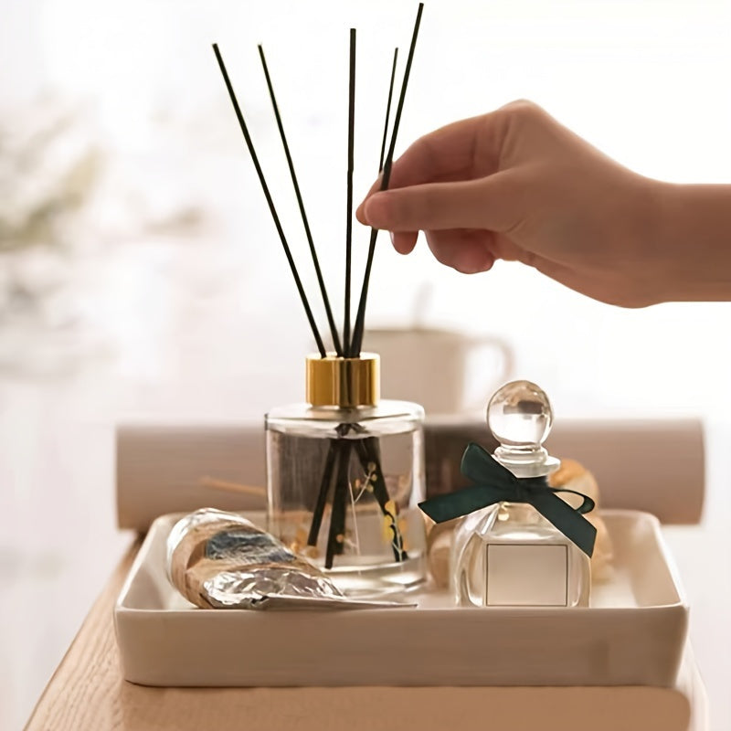 25 elegant fireless rattan reed diffuser sticks with black labels and golden cap for home decor and relaxation.