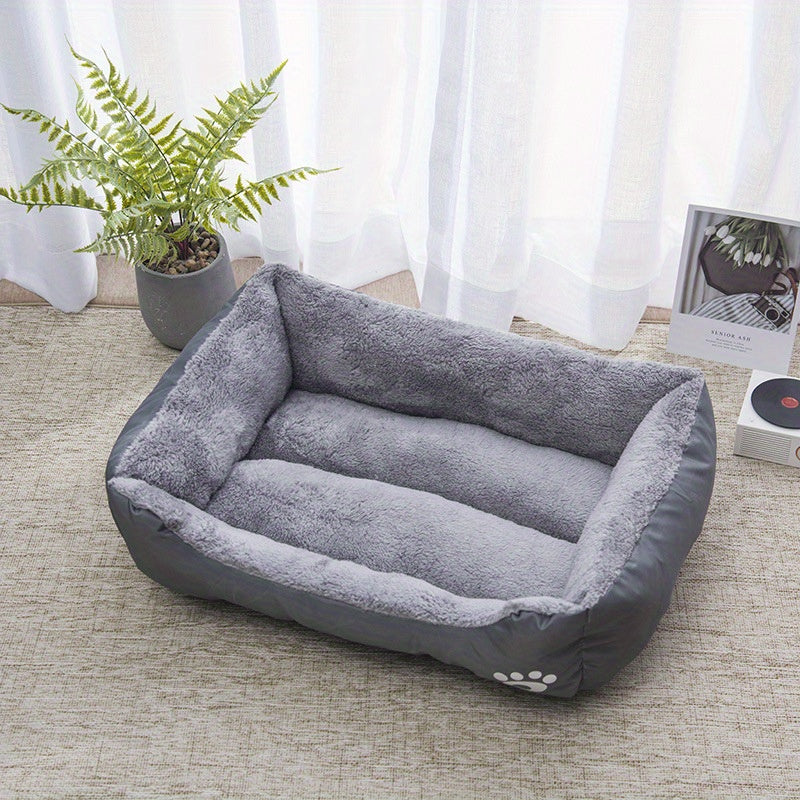 Soft plush pet bed for small to medium dogs, featuring paw prints design, cozy and washable.