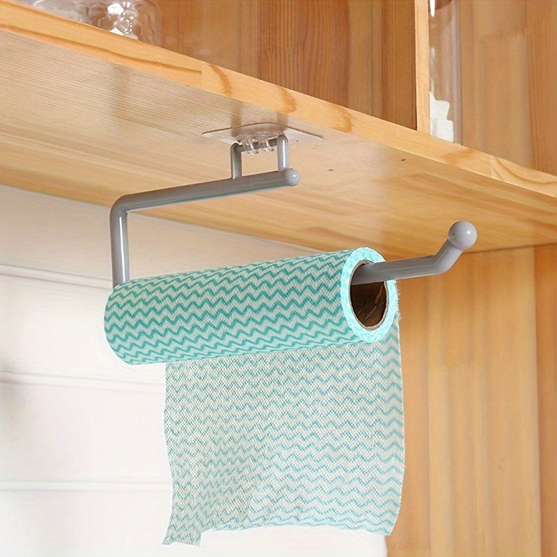 Wall-mounted paper towel holder in sleek gray design saves space, with a no-drill, traceless installation. Perfect for storing Chevron pattern teal towels in the kitchen or bathroom. This durable organizer provides a modern storage solution for your home.