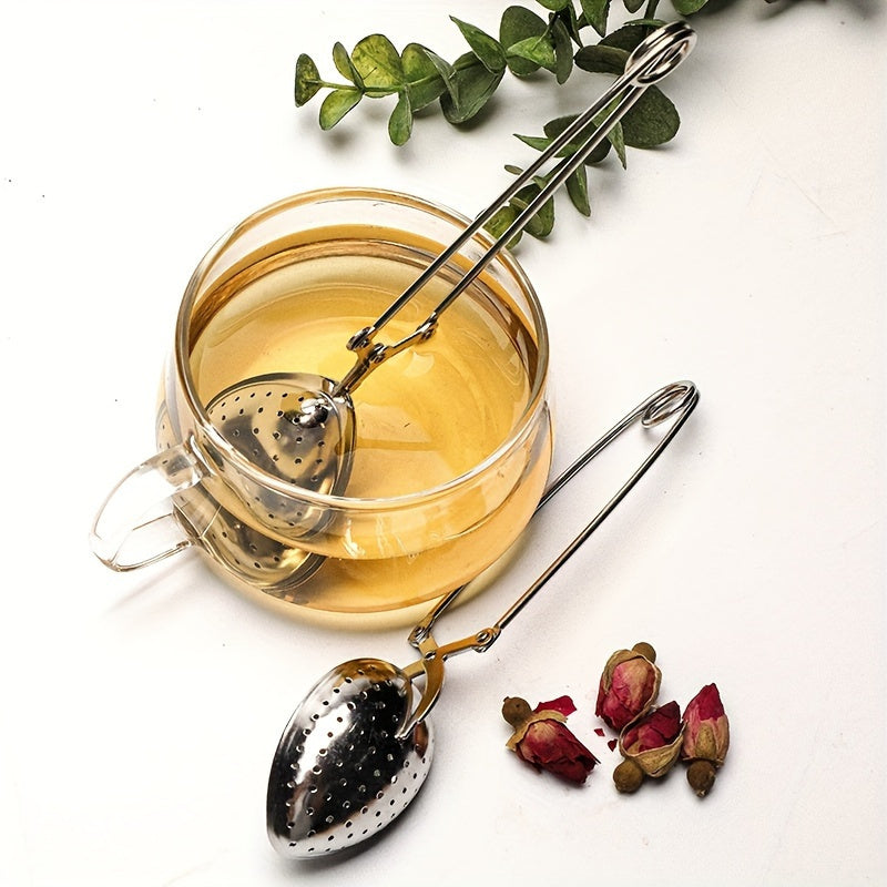 Heart-shaped stainless steel tea infuser with long handle, perfect for steeping loose leaf or herbal tea in the comfort of your home, restaurant, hotel, or office. A versatile tea accessory for your teaware collection.